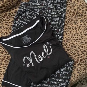 Black top with 3/4 length sleeves w/ white trim on collar & pants- wore once